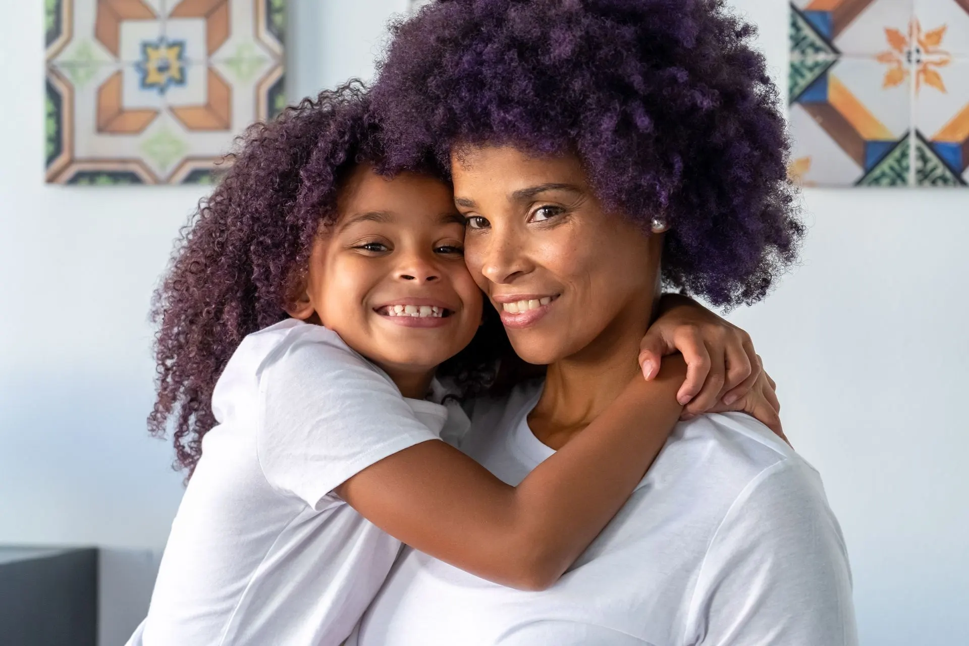 Mother hugging her daughter, identity after motherhood therapy in Charlotte, NC