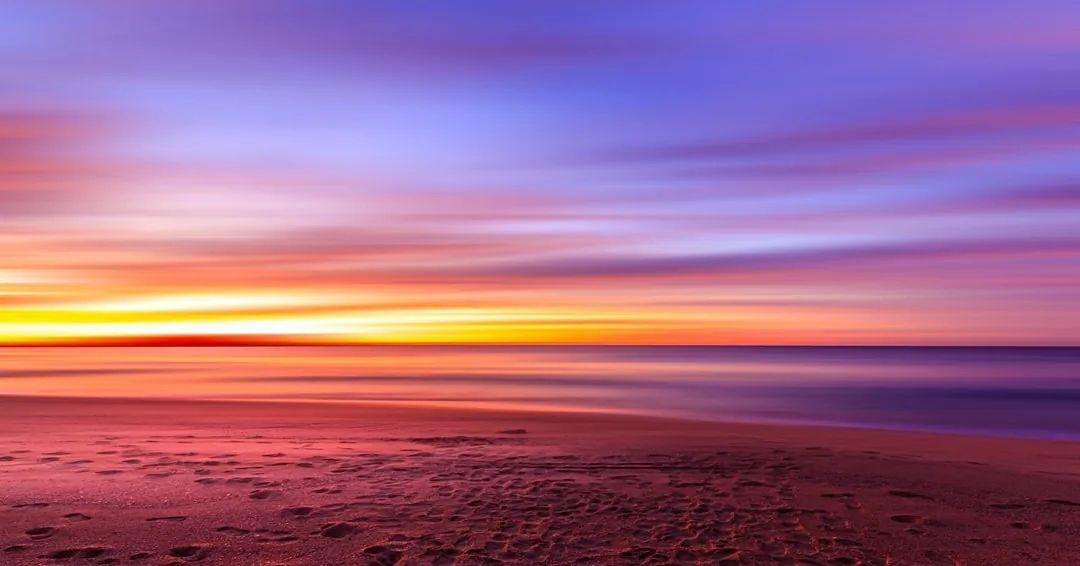 Sunset over open water, representing grief and loss counseling in Charlotte, NC